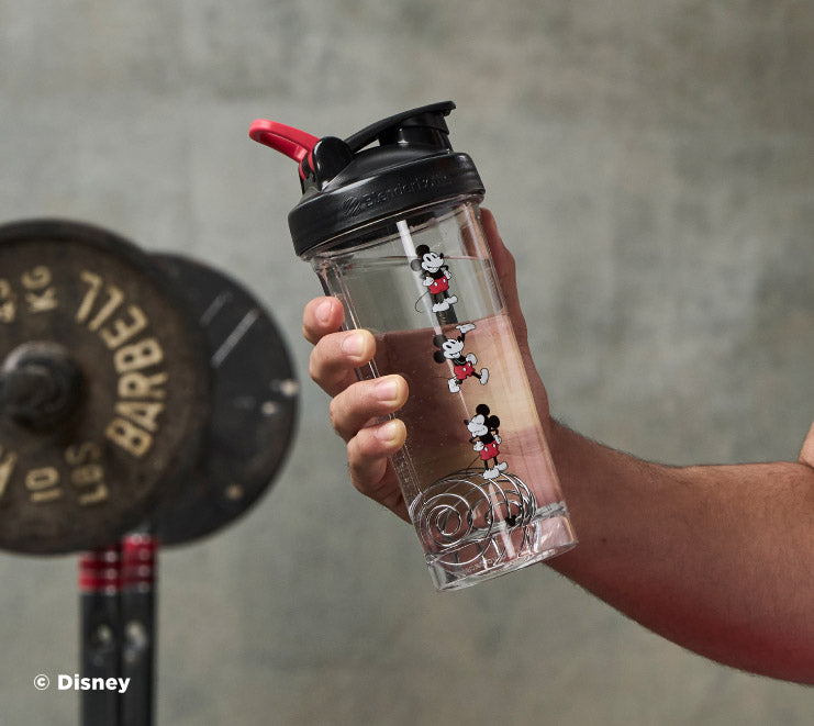 pro-series-n7 Mickey_Mouse_Protein_Shaker_Bottle_Being_Held_In_the_Gym.jpg